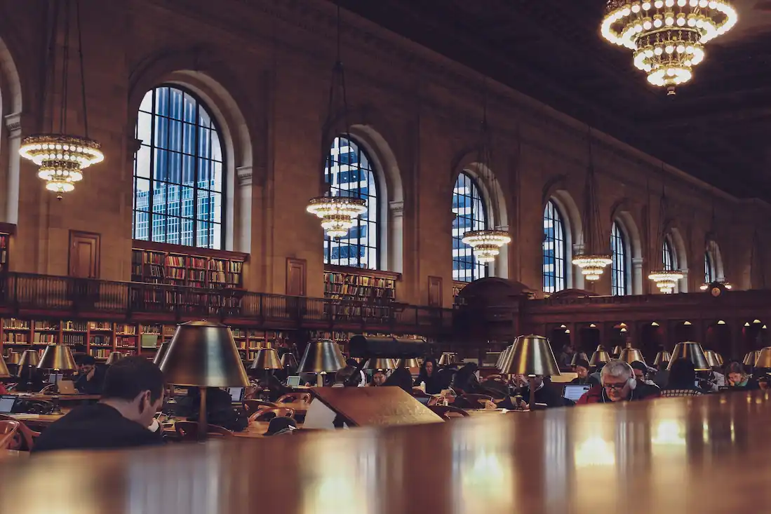 People studying in an old but beautiful library