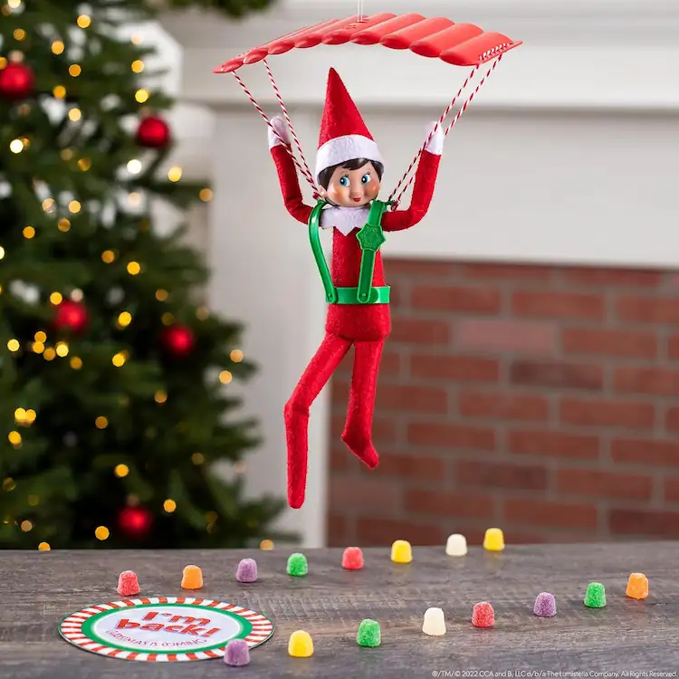 Scout elf doll with a parachute