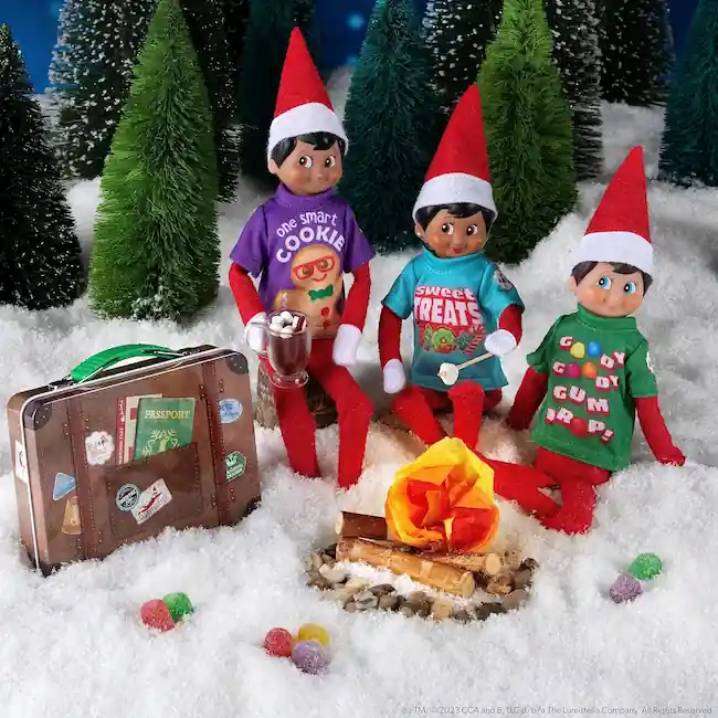 Scout elf doll wearing colorful t-shirts